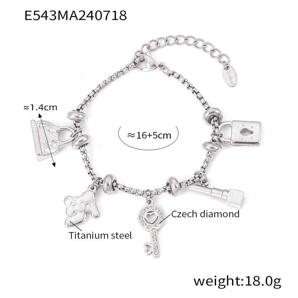 Titanium plated 18K gold multi-element hanging tag with diamond inlaid pendant bracelet